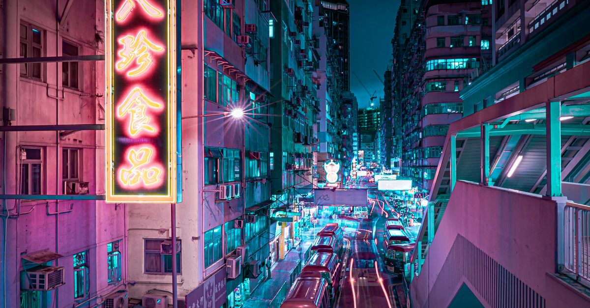 A captivating night view of a Hong Kong street illuminated by colorful neon lights, showcasing urban vibrancy.