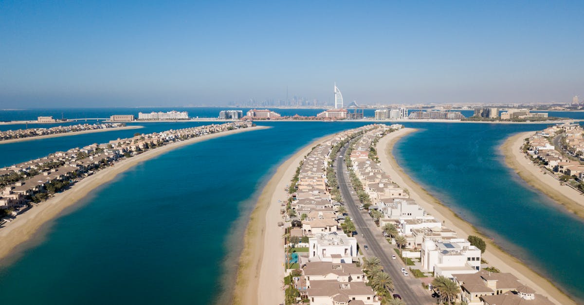 Stunning aerial view of Palm Jumeirah with Burj Al Arab and city skyline in Dubai, UAE.