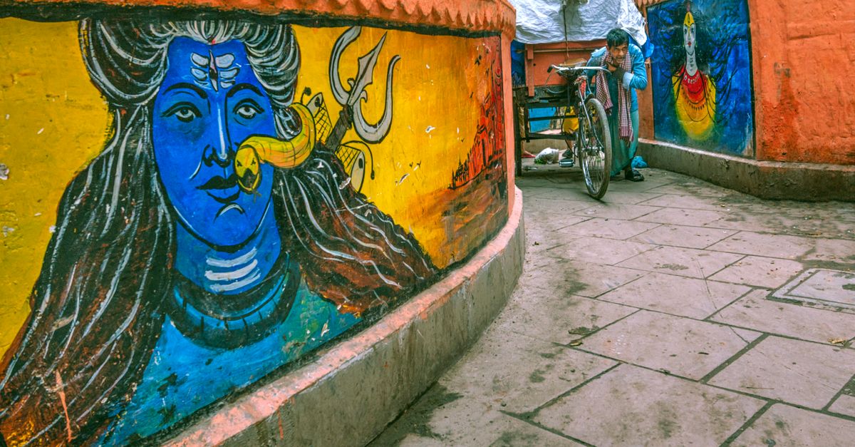 Colorful street murals in Varanasi, capturing the vibrant local culture.