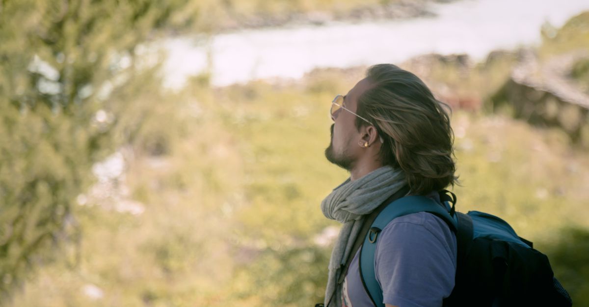 A person hiking in the lush greenery of Nepal, capturing the essence of adventure and natural beauty.