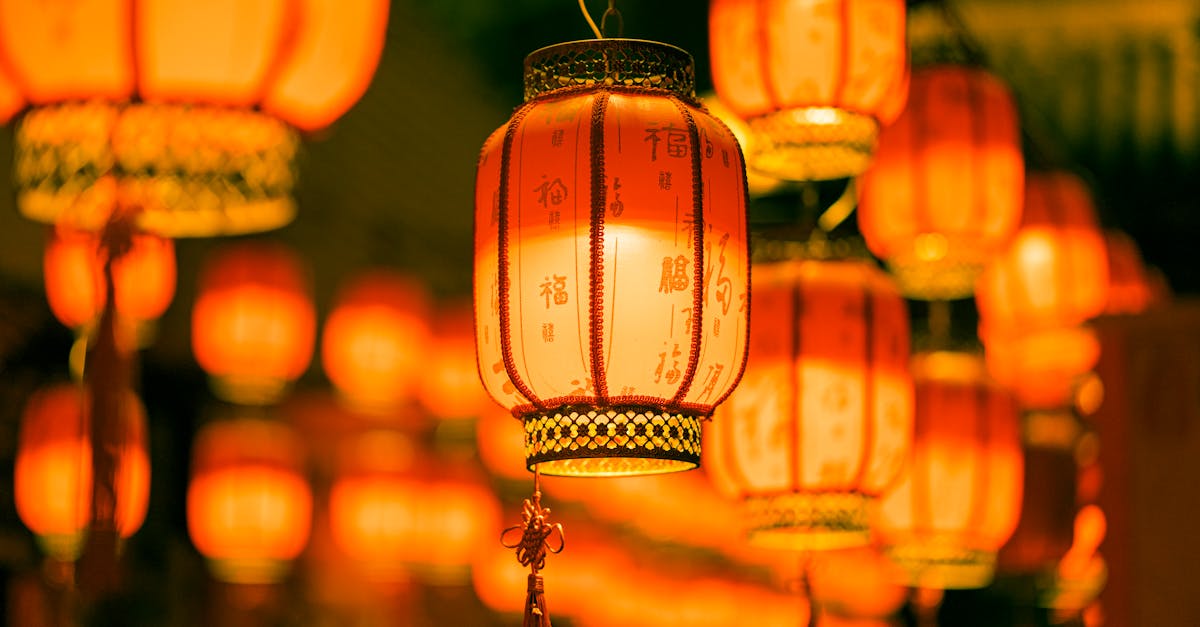 Brightly lit traditional Chinese lanterns create a warm festive atmosphere at night in Shenzhen.