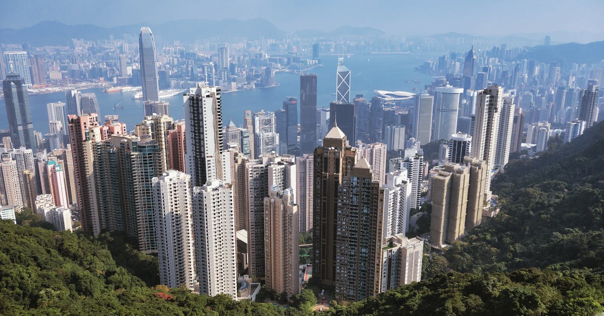 A breathtaking aerial view of Hong Kong's skyscrapers and Victoria Harbor from Victoria Peak.