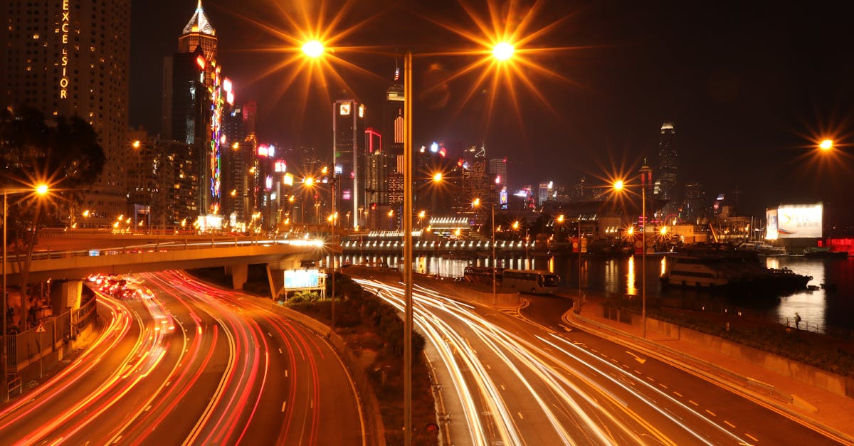 Stunning long exposure night view of a bustling urban expressway with light trails.