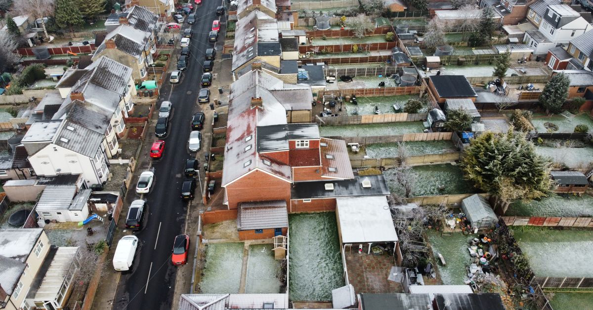 Aerial image of a frost-covered urban residential area with aligned houses.