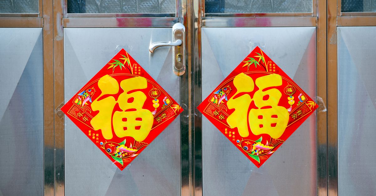 Colorful Chinese New Year door signs symbolizing good fortune and prosperity.