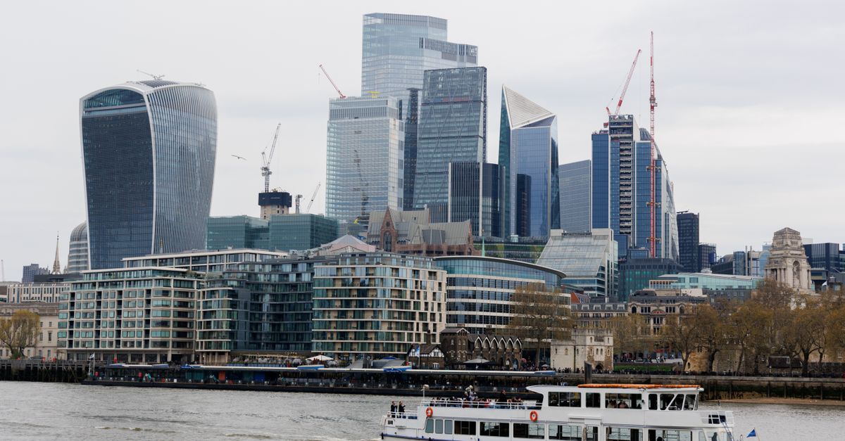 Stunning view of London's modern skyscrapers along the River Thames with a ferry in the foreground.