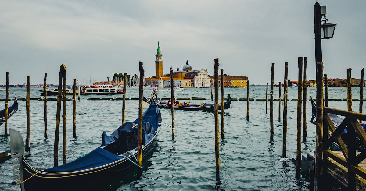 Scenic view of gondolas on the canal with San Giorgio Maggiore in Venice, Italy.
