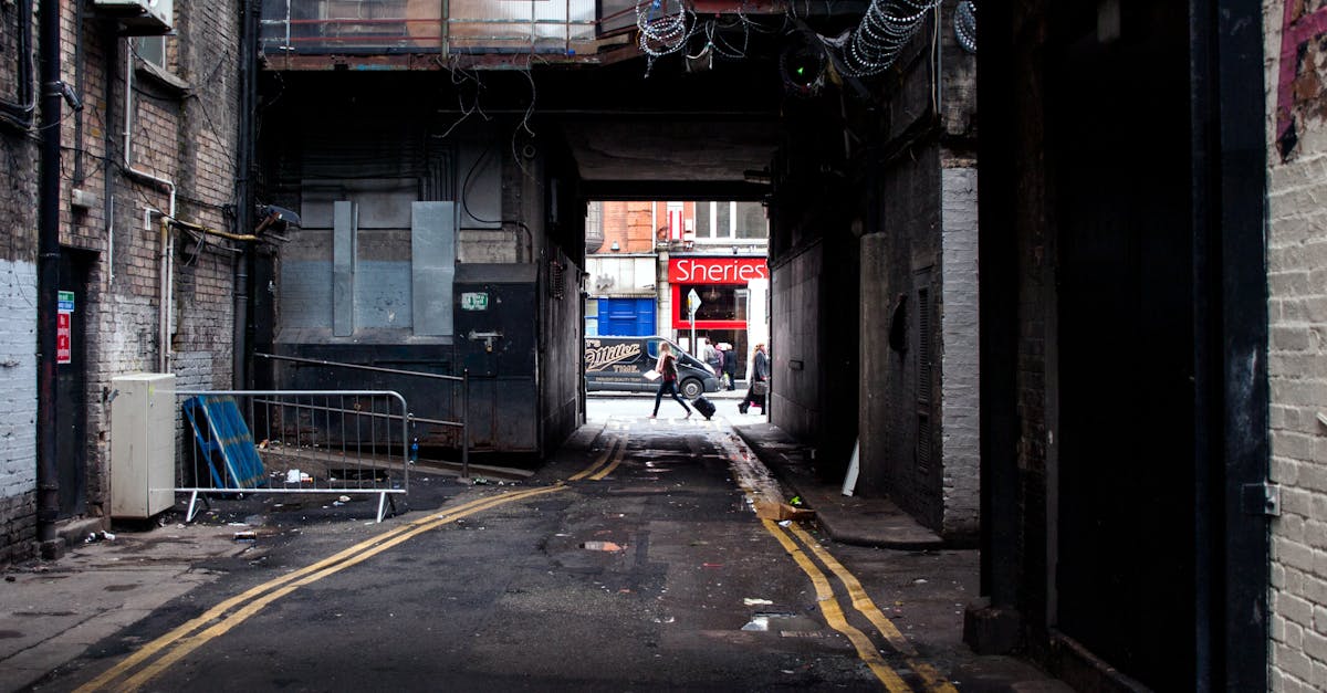 A moody alleyway in Dublin with a street view and urban decay.