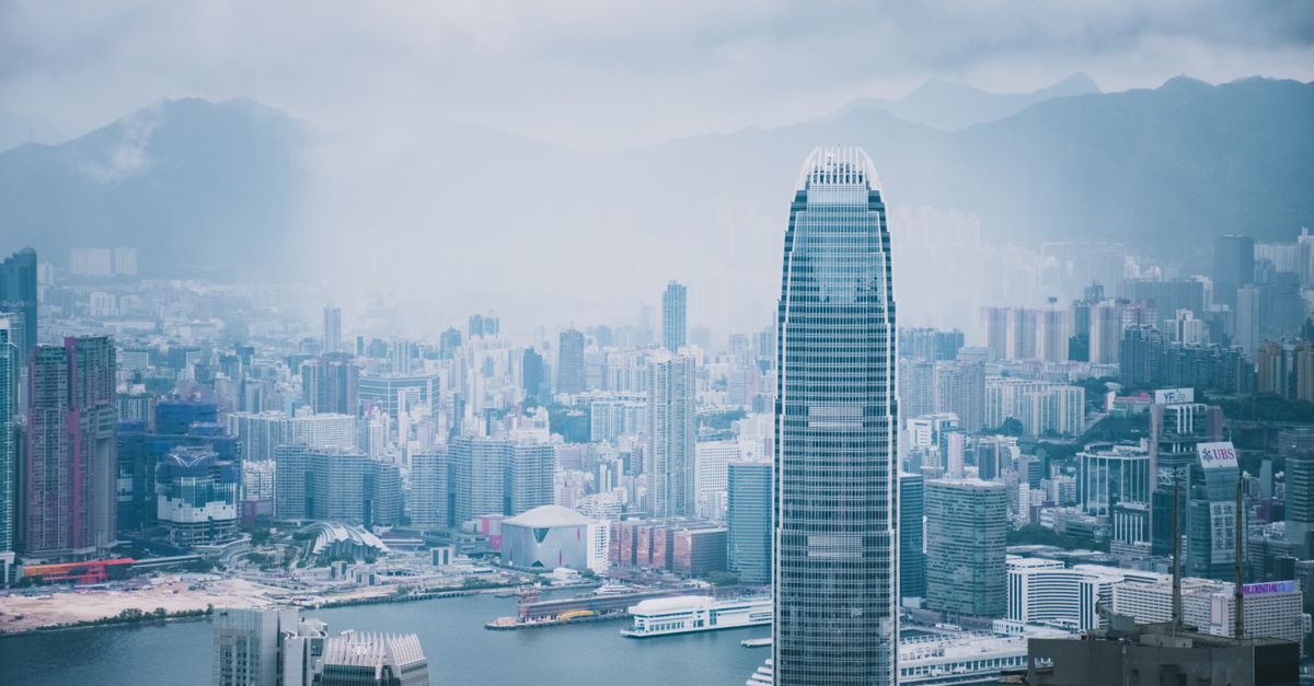 Panoramic view of Hong Kong's modern skyline featuring iconic skyscrapers and urban architecture.