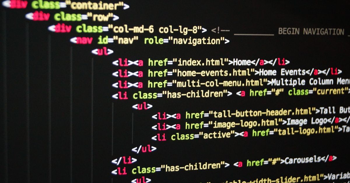 Close-up of vibrant HTML code displayed on a computer screen, showcasing web development and programming.