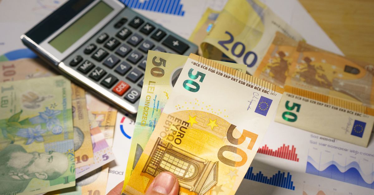 Euro and Romanian Lei currency with calculator on a financial desk setup.