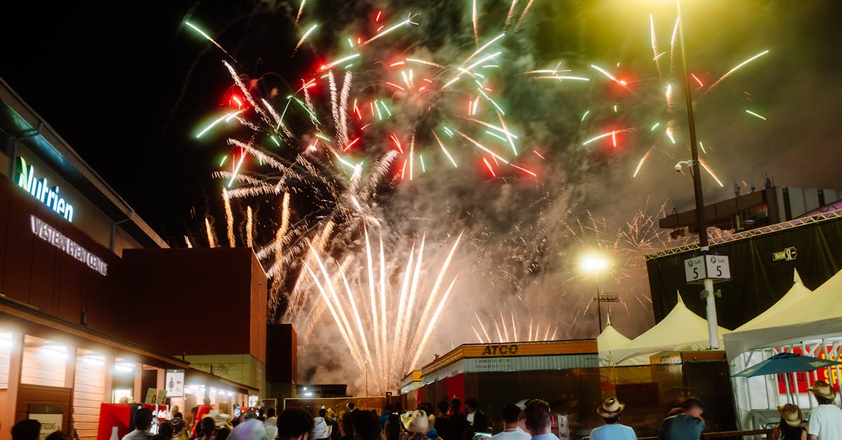 Night festival with a vibrant fireworks display captivating a crowd of people enjoying the event.
