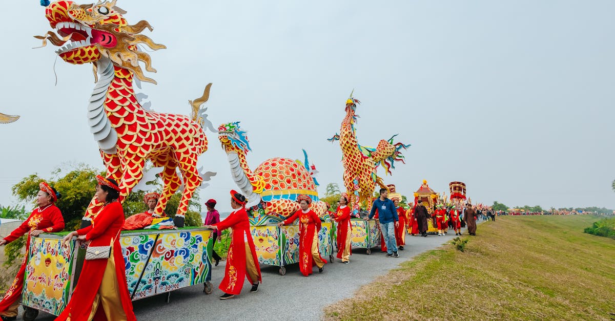 Colorful parade with dragon costumes and people celebrating cultural festival outdoors.