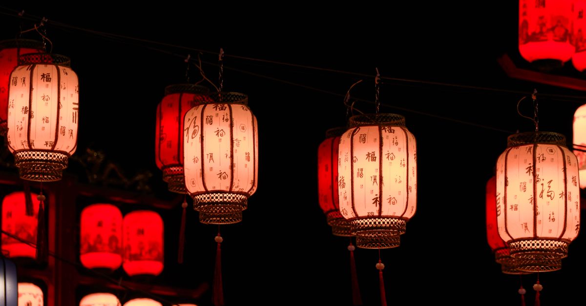 Glowing red lanterns illuminate the night, capturing the essence of a traditional Chinese festival celebration.