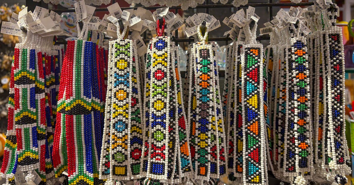 Colorful African beaded crafts hanging in a souvenir shop, showcasing traditional artistry.