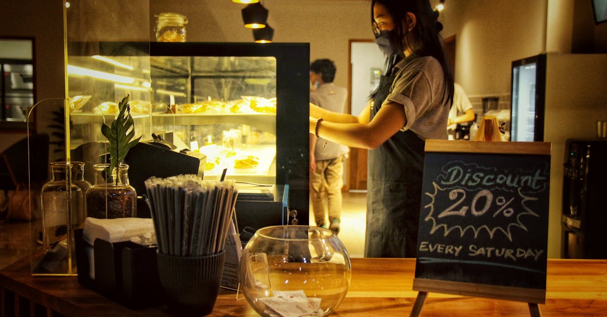 A cafe scene with a barista and discount chalkboard, creating a welcoming atmosphere.