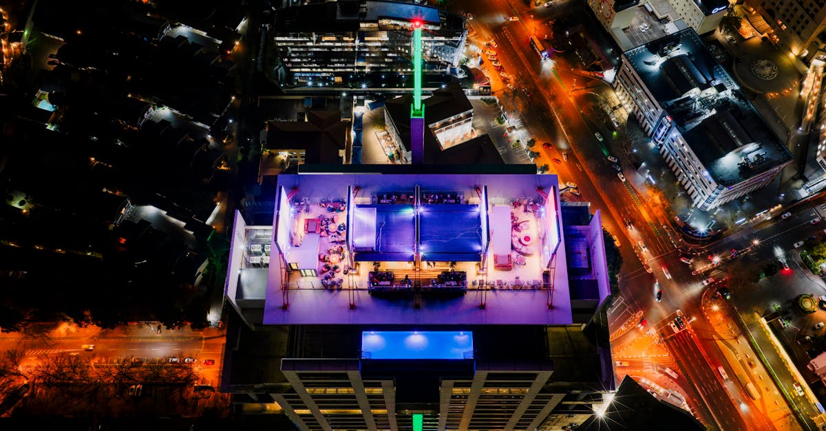 Bird's-eye view of illuminated rooftop in Sandton, South Africa, showcasing vibrant urban life.