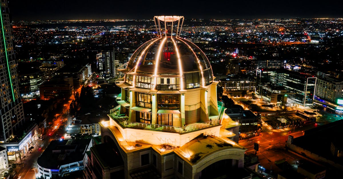 Stunning aerial nighttime view of the illuminated Sandton skyline in Gauteng, South Africa.