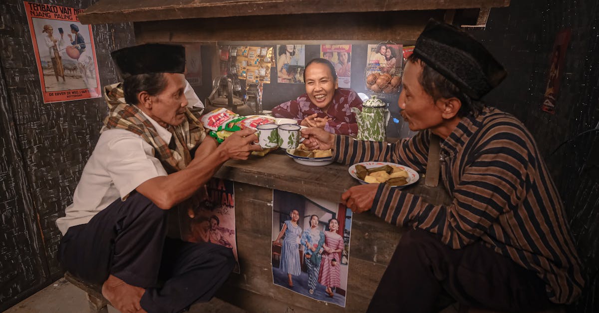Authentic scene of adults enjoying drinks and conversation in a rustic Indonesian coffee shop.