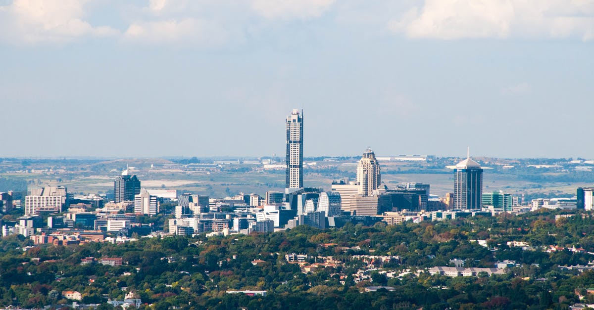 Aerial view of Sandton's skyline in Gauteng, South Africa, with a clear blue sky.