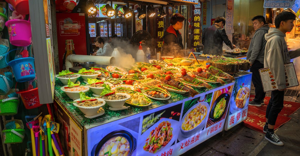 Vibrant night market scene in Xiamen showcasing diverse street food offerings and local culture.