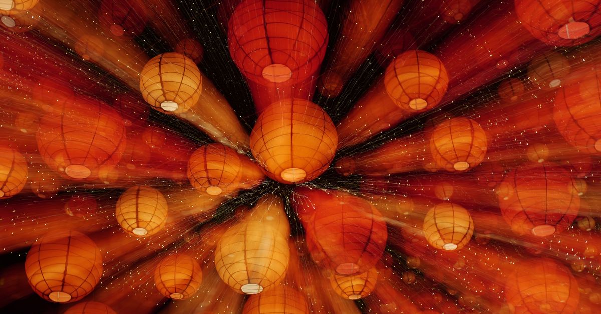 A stunning display of glowing orange lanterns creating a magical night ambiance.