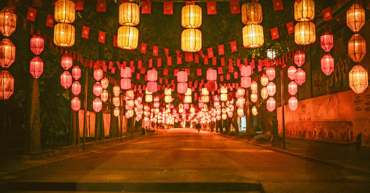 Vibrant lanterns illuminate a street at night, creating a festive ambiance.
