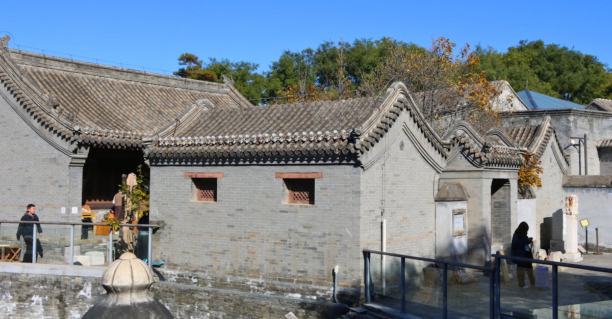 Explore traditional Chinese architecture in a sunny street in Beijing.