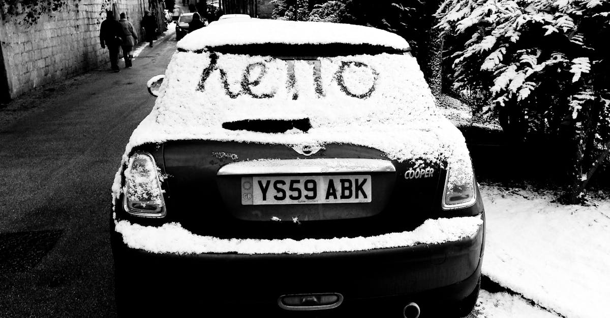 Playful snow-covered car with 'hello' message in Knaresborough, England. Captured in winter.