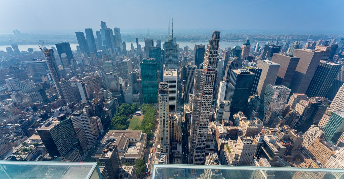 Stunning aerial view of New York City's Midtown skyline on a clear day, showcasing iconic skyscrapers.