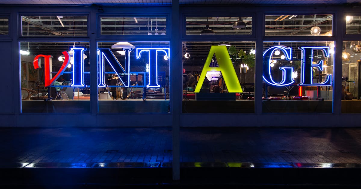 Bright neon 'VINTAGE' sign glowing in a shop window, creating a nostalgic ambiance.