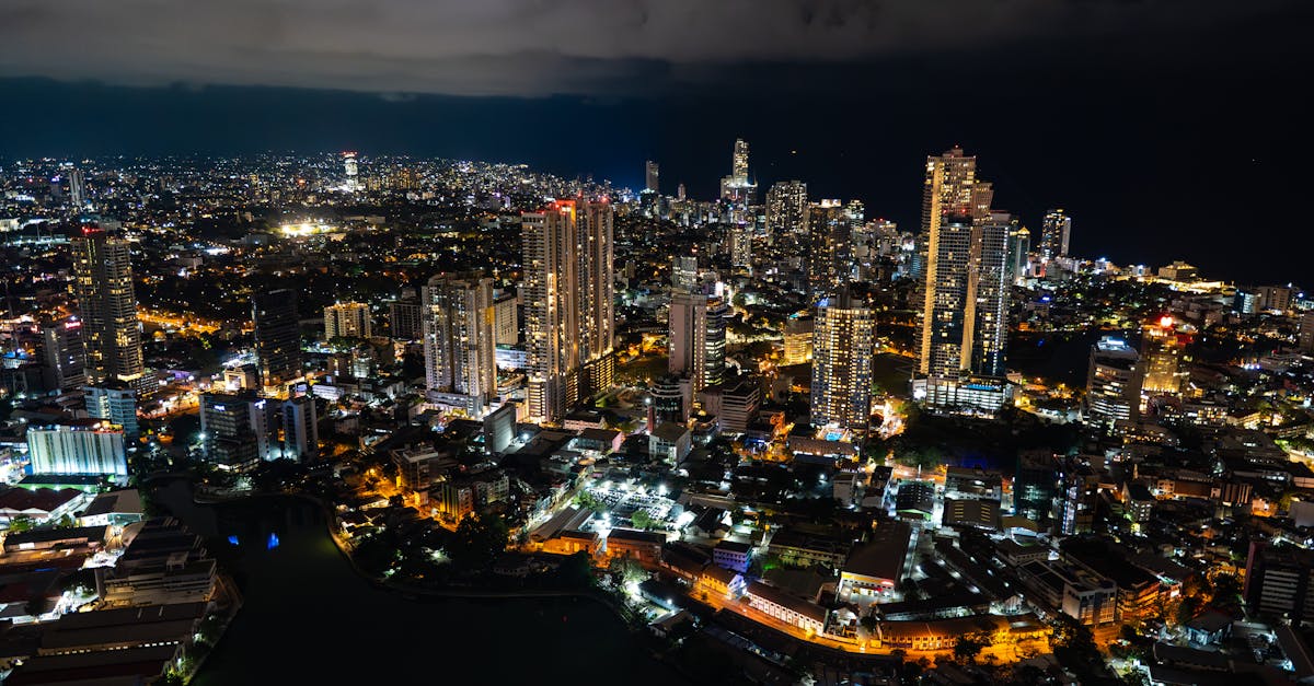 A captivating aerial view of Colombo's cityscape at night, showcasing its vibrant lights and towering skyscrapers.