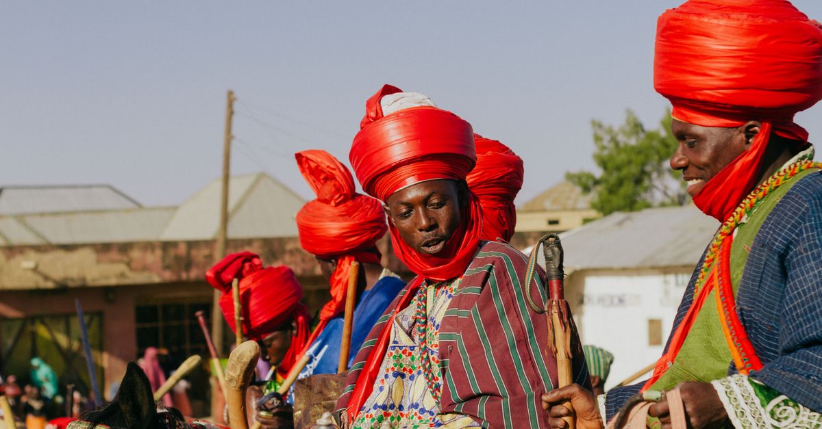 Vibrant cultural festival showcasing traditional attire and festivities in an African setting.