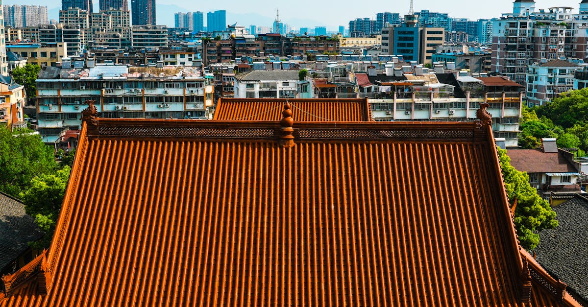 A traditional Chinese temple roof contrasts with a modern urban skyline, showcasing a blend of old and new architecture.