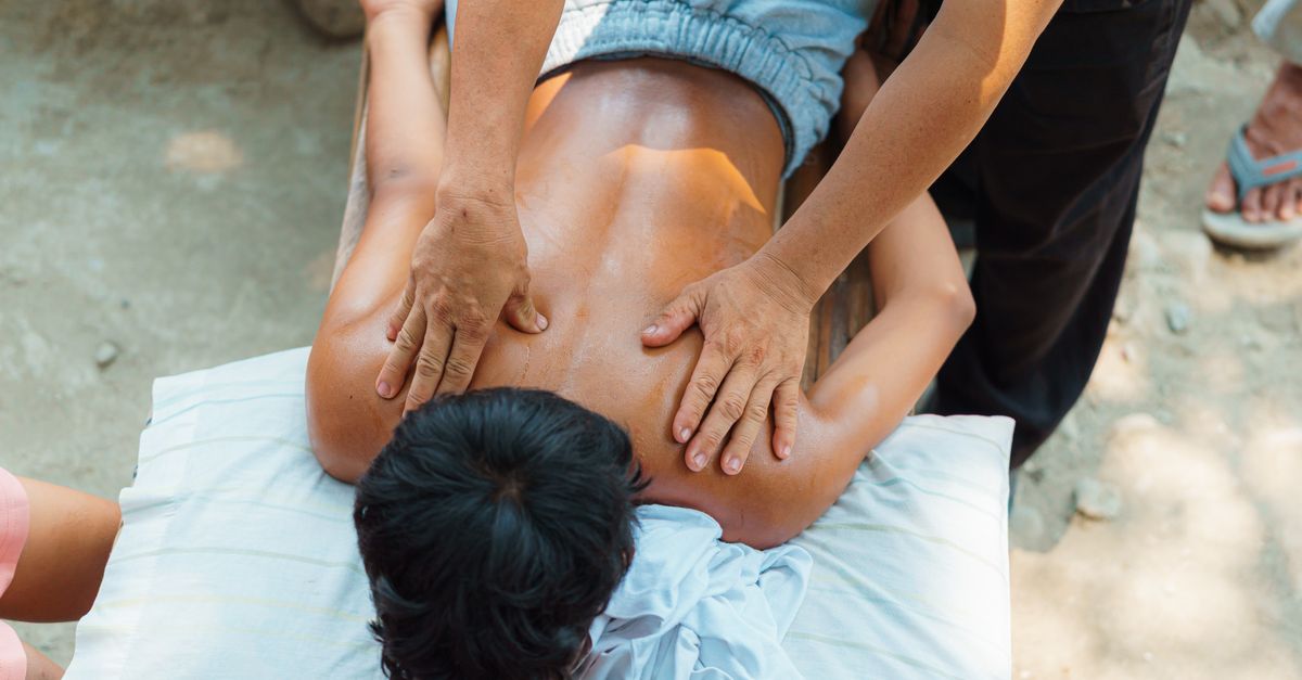 A relaxing outdoor back massage session providing stress relief and wellness benefits.