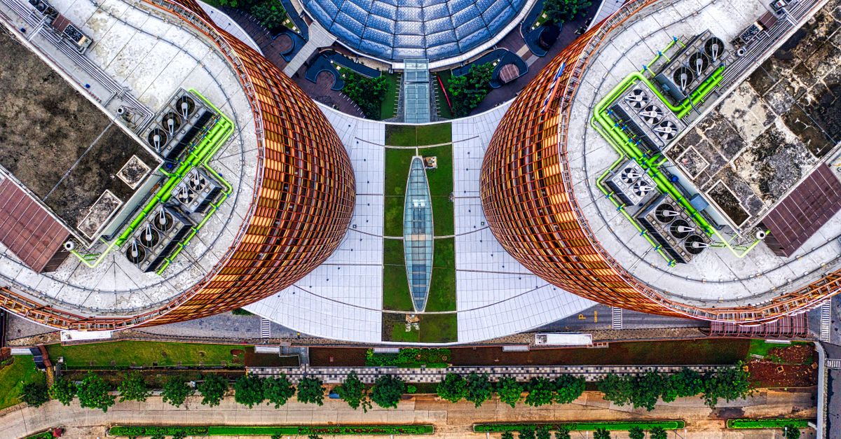 Bird's-eye view of unique modern architecture in Jakarta, showcasing dome roofs and urban design.