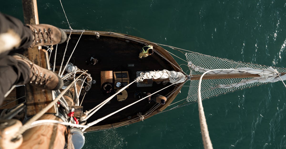 High-angle shot of a sailboat navigating through open waters. Perfect for travel and adventure themes.