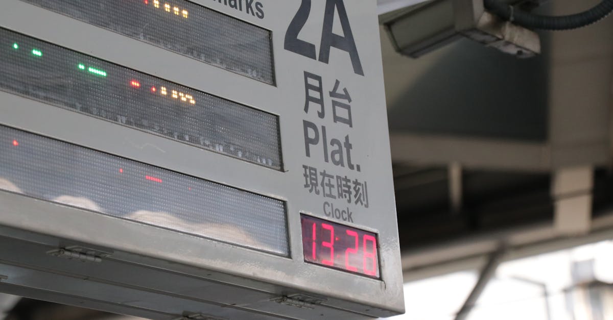 Close-up of an electronic train platform sign showing time and information.