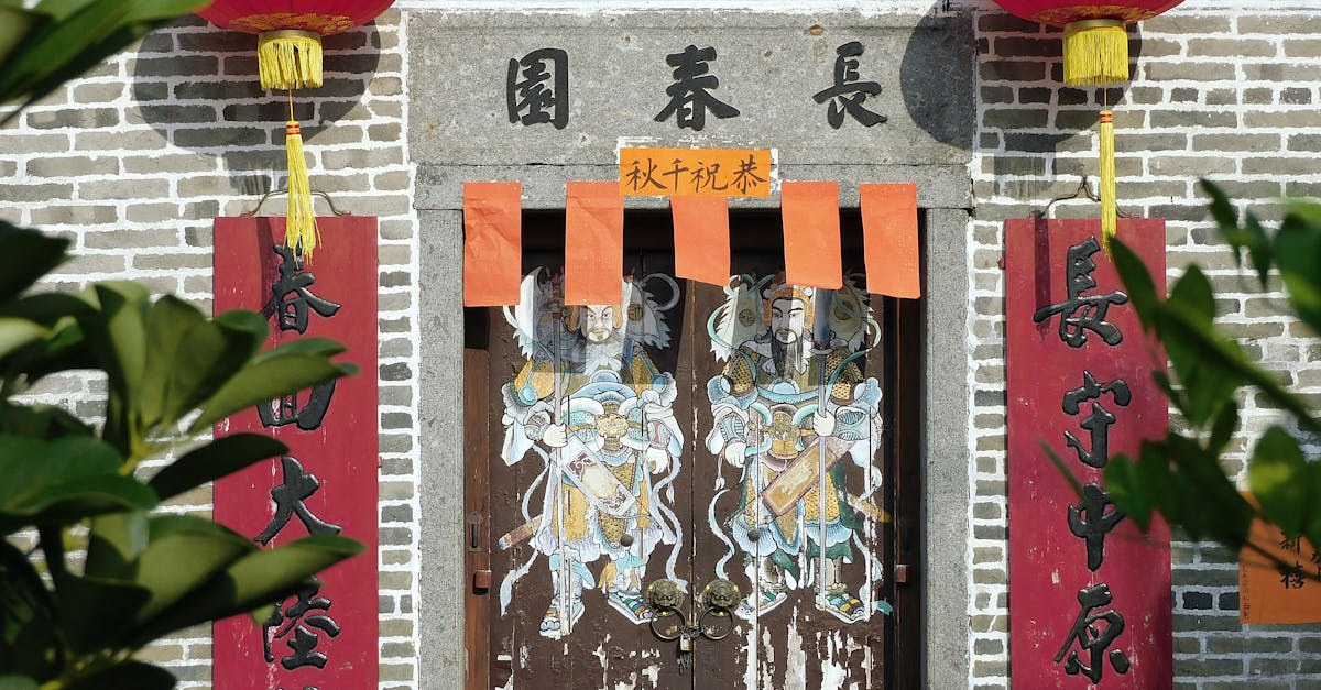 Facade of traditional Cheung Chun Yuen ancestral hall decorated with red lanterns on sunny day in Hong Kong