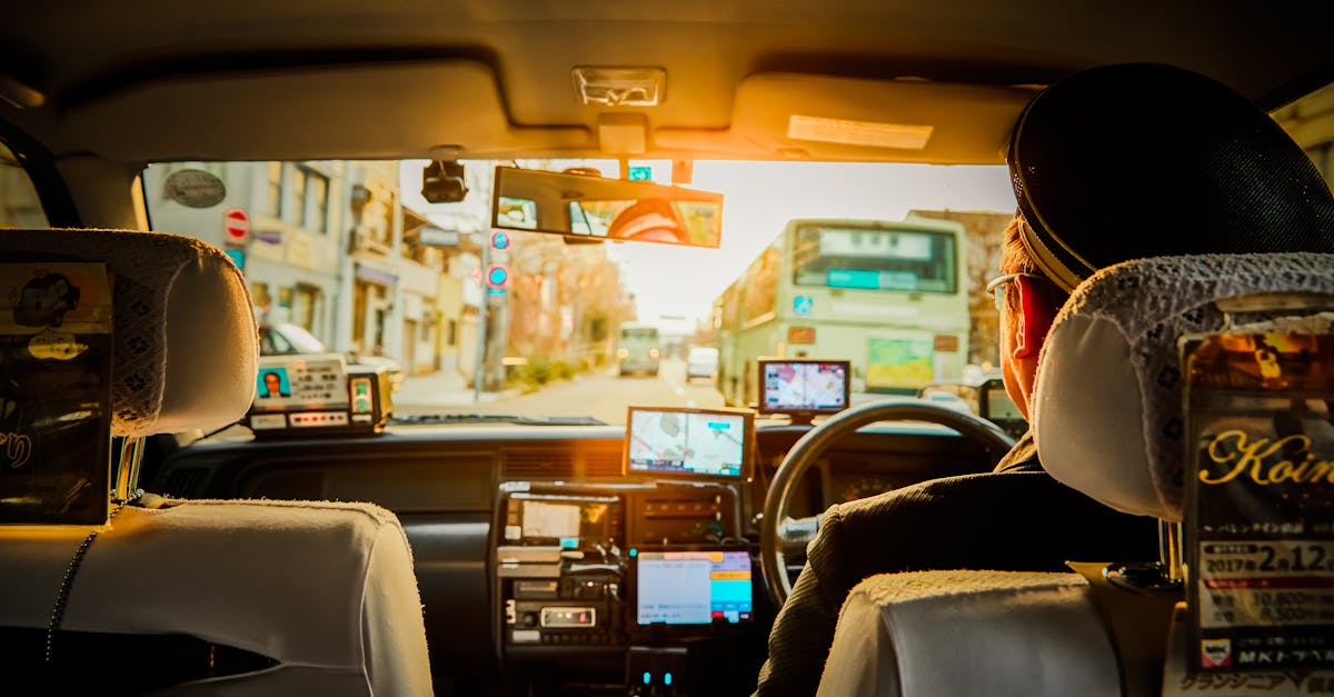 Experience a scenic ride through Kyoto in a traditional taxi, capturing urban life during sunset.