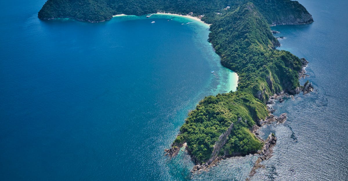 Explore the pristine beauty of a tropical island in Myanmar with crystal clear waters and lush greenery.