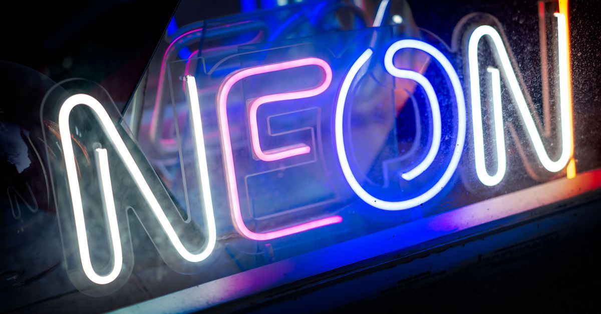 A close-up view of a vibrant neon sign showcasing bright colors and luminescence.