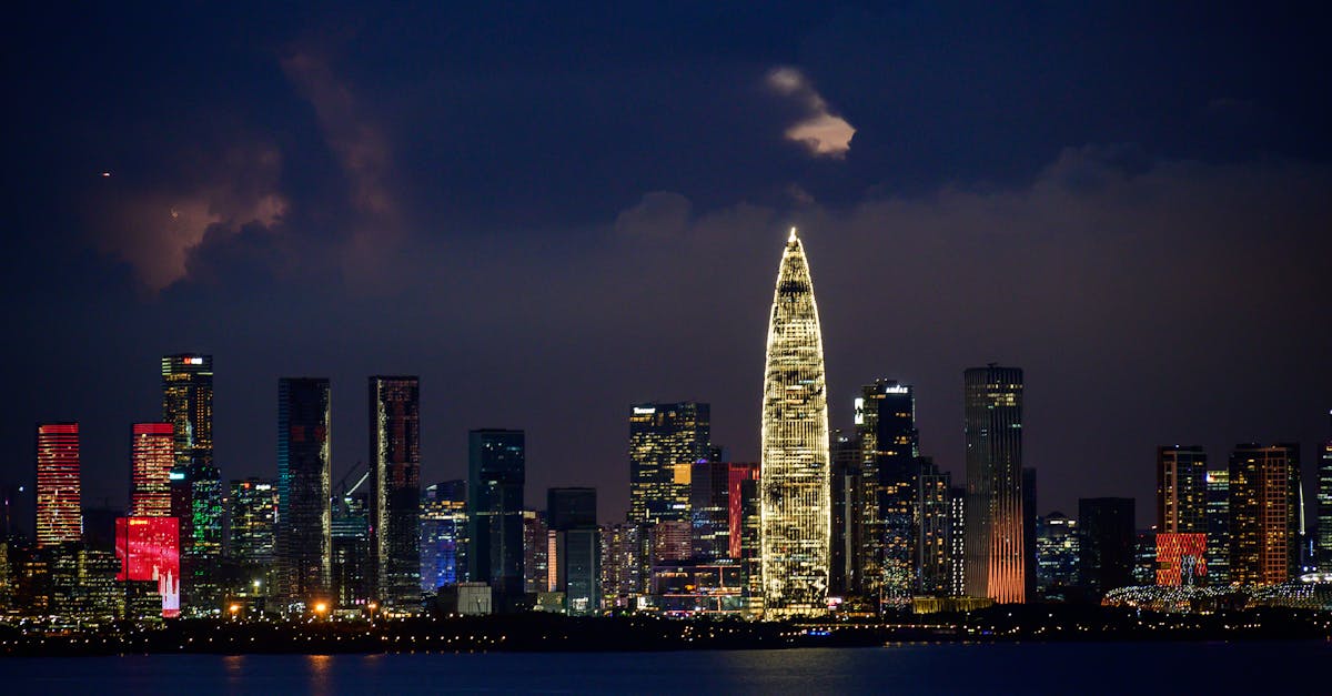 A breathtaking cityscape at night, showcasing illuminated skyscrapers and a vibrant skyline.